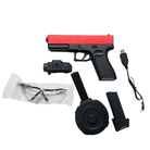 Gelblaster Glock 19 Gen5 Red gel shooter with accessories including a magazine, charger, and tactical flashlight.